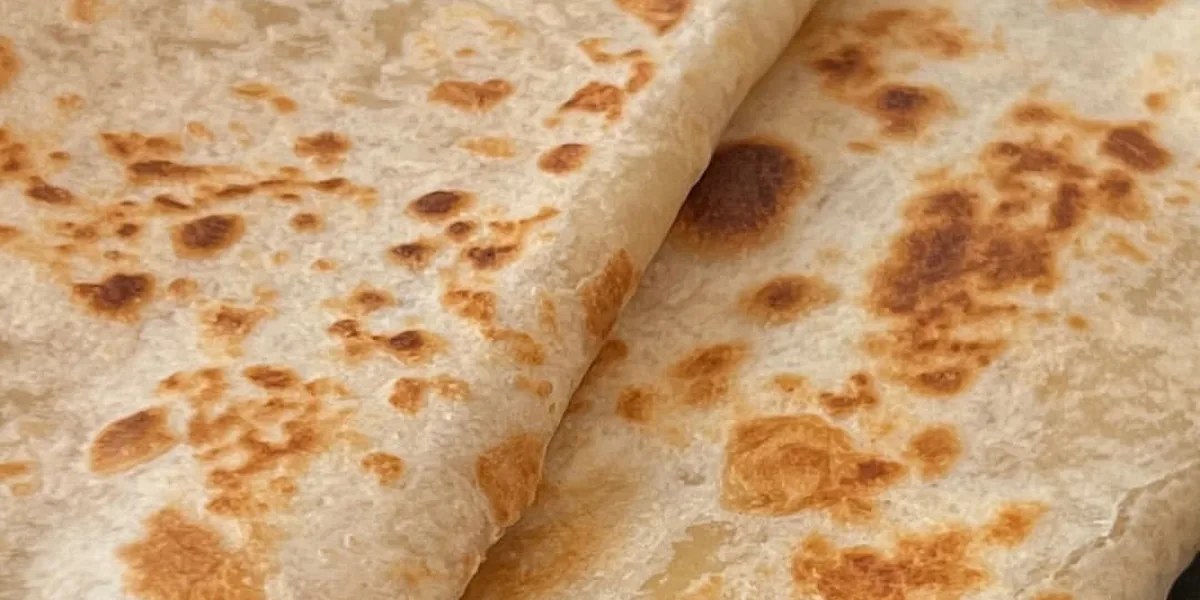 Freshly made flour tortillas, toasted on the comal